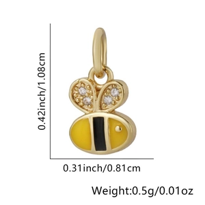 Detail view of gold-plated bee pendant with cubic zirconia wings and size measurements