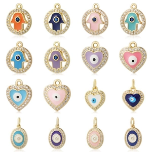 Ciondoli Mano di Fatima e Malocchio placcati in oro con micro-set di zirconi