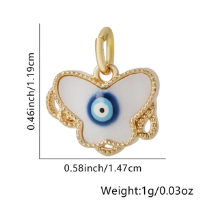 Macro shot of gold butterfly evil eye pendant showing precise 1.19cm by 1.47cm dimensions
