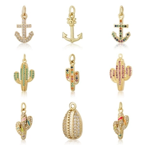 Detailed grid of gold charms with cubic zirconia cactus, anchor and shell shapes