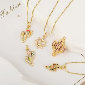 Golden necklace with cactus pendants featuring colorful zircon and enamel details