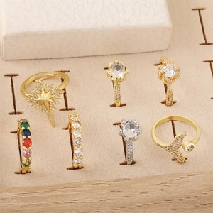 Vintage palace style jewelry set featuring starburst and whale tail rings with zircon