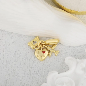 Reisethema Gold-Anhänger Set mit Flugzeug, Koffer und Herz-Zirkonia Charms