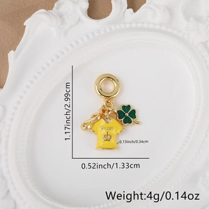 Detail view of soccer jersey pendant and green clover charm with size measurements