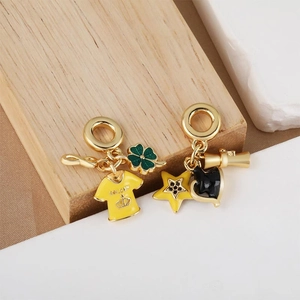 Golden Brazil charm set with yellow jersey and green four-leaf clover enamel pendants
