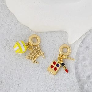 Golden volleyball and makeup charms with colorful enamel and rhinestone detailing