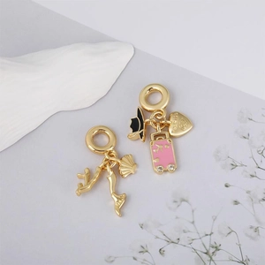 Gold heart travel pendants with enamel pink suitcase and seashell beach charms
