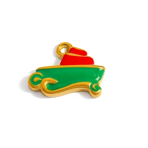 Détail d'un pendentif de Noël doré en acier inoxydable avec émail vert et rouge
