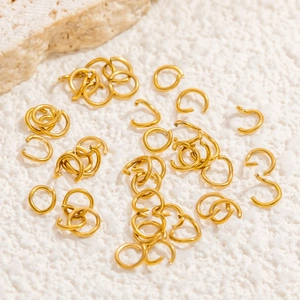 Macro shot of 18K gold-plated open jump rings for DIY jewelry making and connectors
