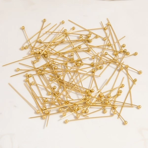 Macro view of gold plated stainless steel ball head pins for DIY jewelry making