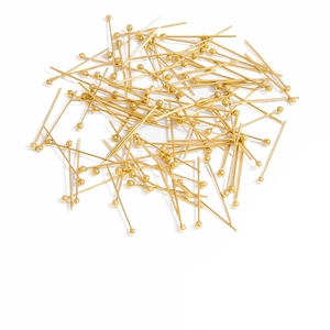 Macro shot of 18K gold plated ball head pins for professional DIY jewelry making and beading