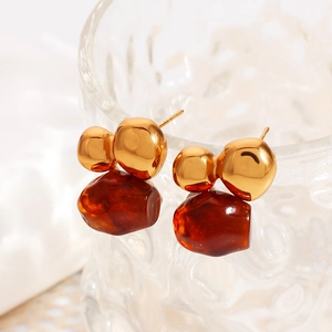 Retro stainless steel earrings with amber resin drop on decorative glass cup