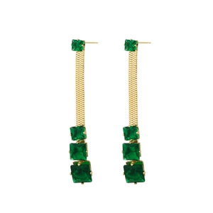 Close-up of vintage gold tiered emerald earrings with square gemstones and flat snake chains