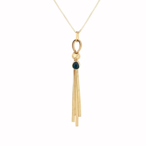 Detail of gold tassel necklace with blue teardrop gemstone and polished metal bead