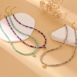 Handmade beaded necklaces with colorful matte beads and gold gemstone pendants