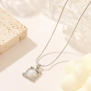 French vintage silver snake chain necklace with square wavy frame and iridescent pearl pendant