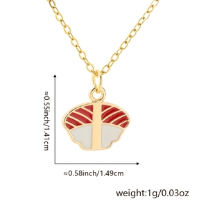 Macro shot showing dimensions of salmon sushi pendant on 18K gold plated copper chain
