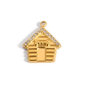 Macro detail of gold-plated dog house pendant with pave crystals and bone motif