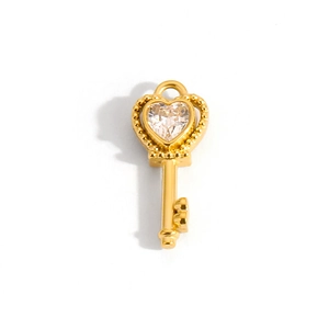 Detailed close-up of 14k gold-plated heart-shaped key pendant with clear zircon stone