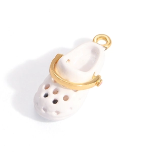 Detail of white enamel clog charm with golden strap and hollow holes for DIY necklaces