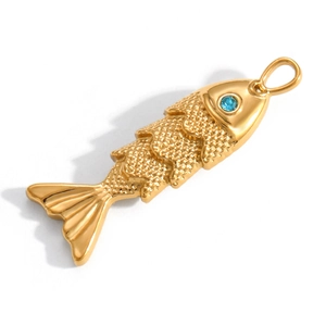 Detailed view of golden fish pendant with blue gemstone eye and embossed scales