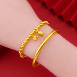 Elegante set di bracciale con ciondolo a loto e rigido opaco dorato da donna