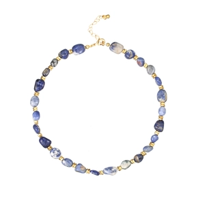 Vintage style natural sodalite beaded necklace with golden metal spacers on white background