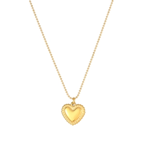 Close-up of golden heart pendant with beaded edges on a delicate ball chain necklace