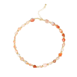 Detail of natural agate stone necklace with gold spacers and adjustable chain closure