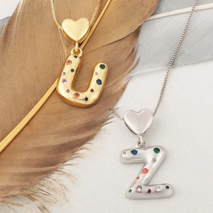 Collane con iniziali a cuore in zircone colorato, finiture oro e argento, ciondoli U e Z