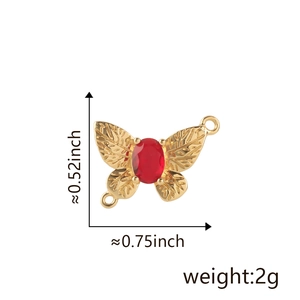Detail of 18k gold butterfly pendant with red gemstone and dimensions measurement