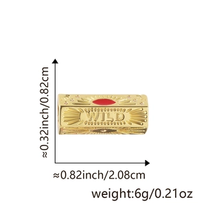 Macro detail of gold-plated WILD charm with red enamel and pavé crystals for DIY jewelry