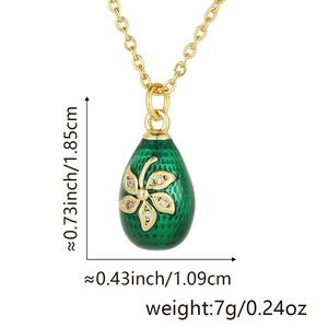 Detail of green enamel egg pendant with 18k gold plating and size measurements