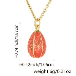 Macro detail of red egg pendant necklace showing textured surface and dimensions
