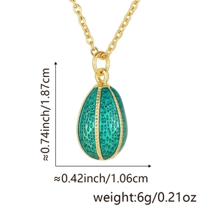 Macro detail of green enamel egg pendant showing dimensions 1.87cm height and 1.06cm width