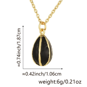 Detail of egg-shaped black enamel pendant with gold stripes showing 1.87cm height