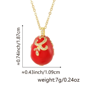Macro shot of red enamel egg pendant with white rhinestone floral details and dimensions