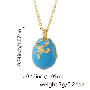 Faberge-style egg pendant necklace with dimensions 1.87cm height and 1.09cm width detail