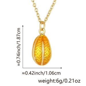 Macro shot of egg-shaped golden pendant with textured orange enamel and dimensions
