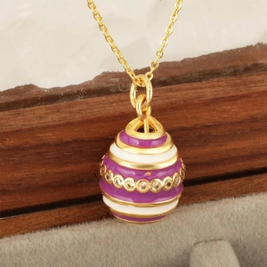 Faberge style purple enamel egg pendant necklace with white zircons and 18K gold plating
