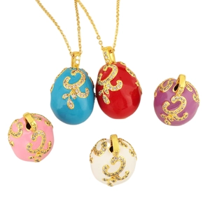 Fabergé style enamel egg pendants with golden vine patterns and zircons in five colors
