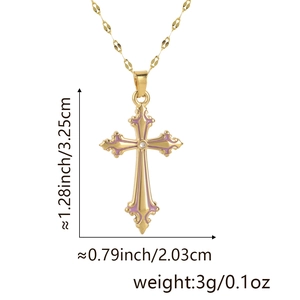 Detail of gold cross pendant with purple enamel edges and dimensions 3.25cm by 2.03cm