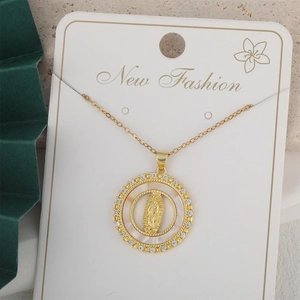 Vintage gold layered necklace featuring a Virgin Mary relief pendant with white zircon stones