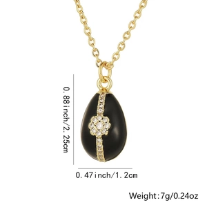 Detail showing dimensions of gold-plated egg pendant with black enamel and zircons