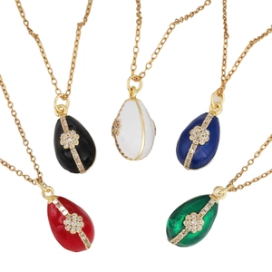 Five gold necklaces with colorful enamel egg pendants and sparkling zircon inlays