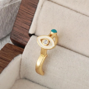 Golden evil eye hoop earrings with white enamel, zircon stone and turquoise bead detail