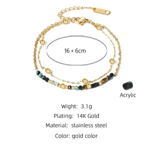Detail of double-layer gold stainless steel bracelet with green acrylic beads and lobster clasp