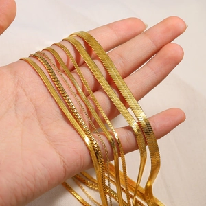 Golden stainless steel snake chain necklaces in various widths for layered fashion looks