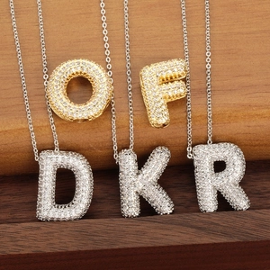 Iced out bubble letter pendants with cubic zirconia on gold and silver chain necklaces