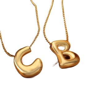 Polished gold 3D puffy letter necklace featuring C and B pendants on a classic bead chain